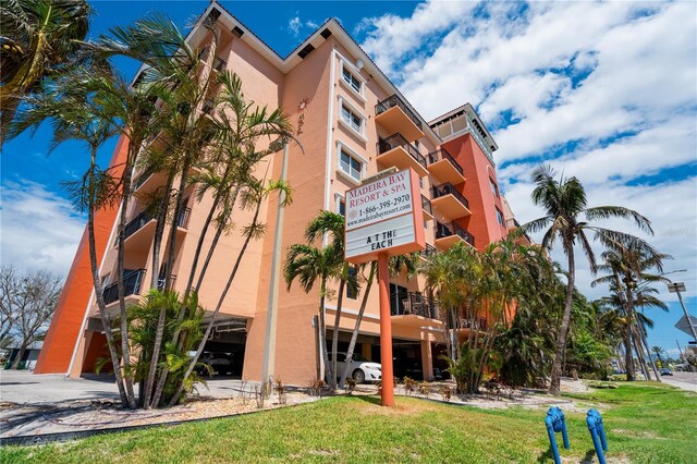13235 Gulf Blvd Unit 402, Saint Petersburg, FL 33708 - view of apartment building / complex with a garage