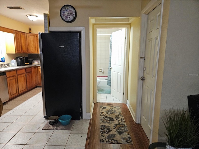 1114 27th St SE Unit A, Ruskin, FL 33570 - kitchen with stainless steel appliances, brown cabinets, and a sink