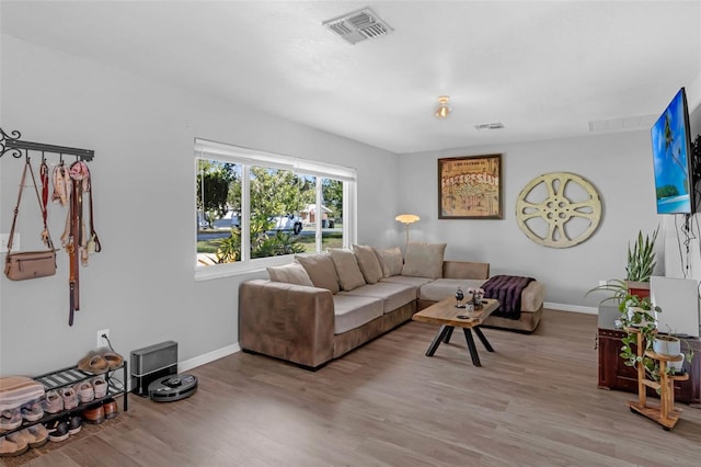 4727 Wales St, Lake Wales, FL 33859 - living room with baseboards and light wood-style flooring