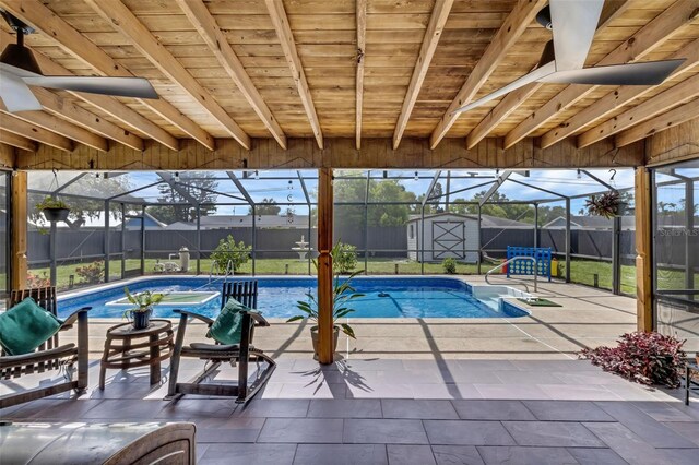 4727 Wales St, Lake Wales, FL 33859 - view of swimming pool featuring glass enclosure, a shed, and a patio