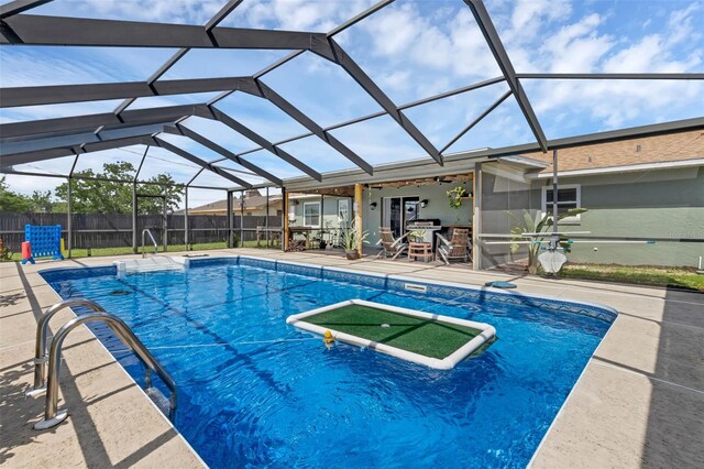 4727 Wales St, Lake Wales, FL 33859 - view of swimming pool featuring a patio, fence, and glass enclosure