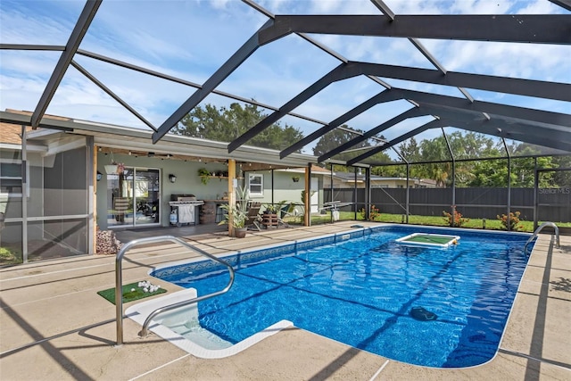 4727 Wales St, Lake Wales, FL 33859 - view of swimming pool featuring a patio area, fence, and glass enclosure