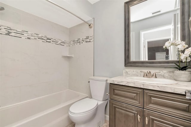 bathroom featuring toilet, shower / bathtub combination, and vanity