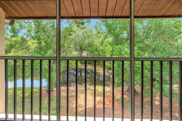 wooden deck featuring a water view