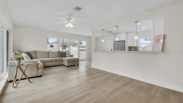 281 44th Ave, St Pete Beach, FL 33706 - living area featuring light wood-style flooring, baseboards, ceiling fan, and recessed lighting