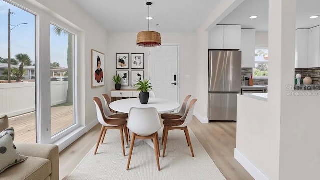 281 44th Ave, St Pete Beach, FL 33706 - dining room with light wood-type flooring, recessed lighting, and baseboards