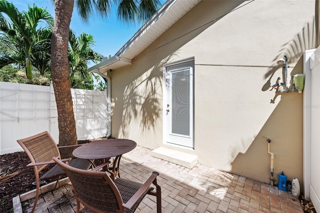 281 44th Ave, St Pete Beach, FL 33706 - view of patio / terrace featuring fence