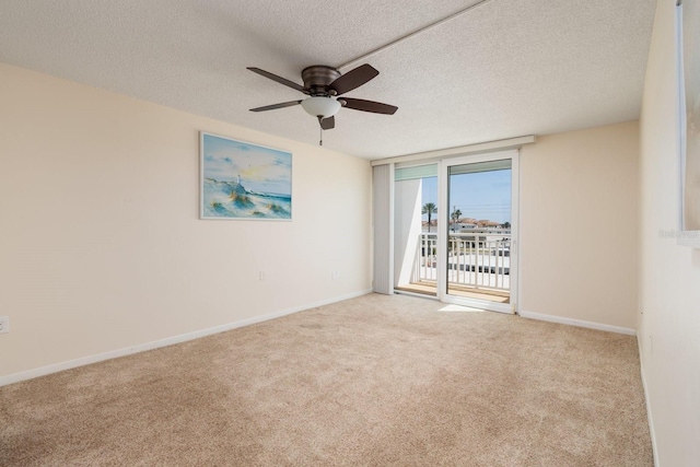 17408 Gulf Blvd Unit 203, Redington Shores, FL 33708 - carpeted empty room featuring a ceiling fan, baseboards, and a textured ceiling