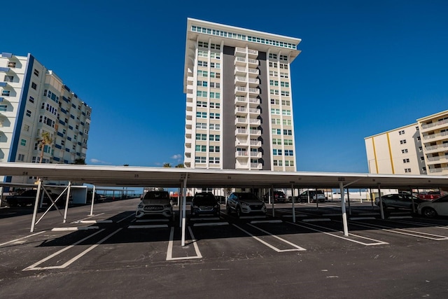 17408 Gulf Blvd Unit 203, Redington Shores, FL 33708 - view of building exterior with covered parking