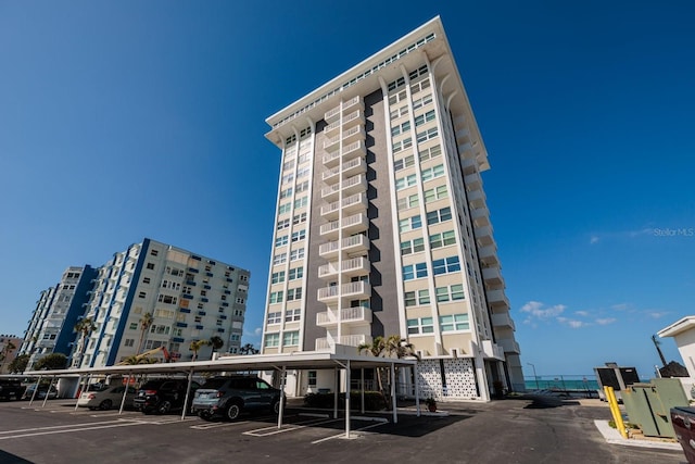 17408 Gulf Blvd Unit 203, Redington Shores, FL 33708 - view of building exterior with covered parking