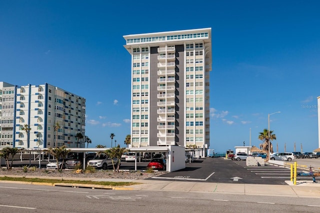 17408 Gulf Blvd Unit 203, Redington Shores, FL 33708 - view of apartment building / complex featuring covered and uncovered parking