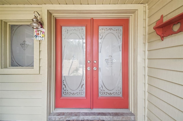 entrance to property featuring french doors