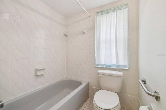 full bath featuring toilet, tile patterned flooring, and shower / bath combination