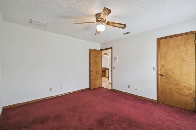 unfurnished bedroom with carpet flooring, baseboards, and ceiling fan
