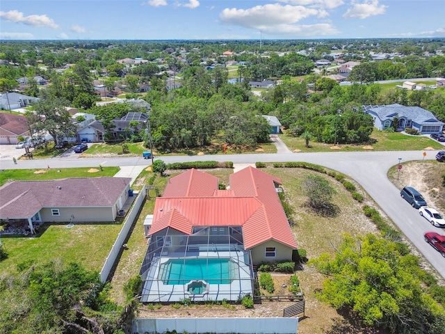 aerial perspective of suburban area featuring a pool