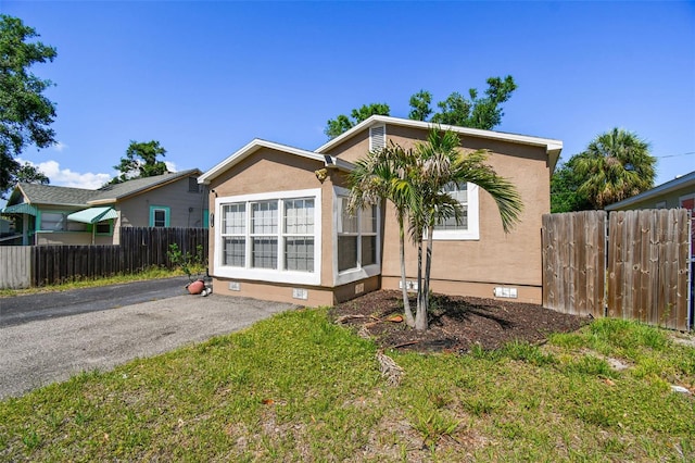 2018 21st St S, Saint Petersburg, FL 33712 - view of front of property with crawl space, fence, and stucco siding