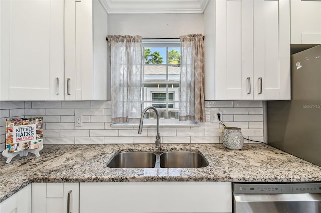 2018 21st St S, Saint Petersburg, FL 33712 - kitchen featuring dishwasher, a sink, crown molding, and white cabinetry