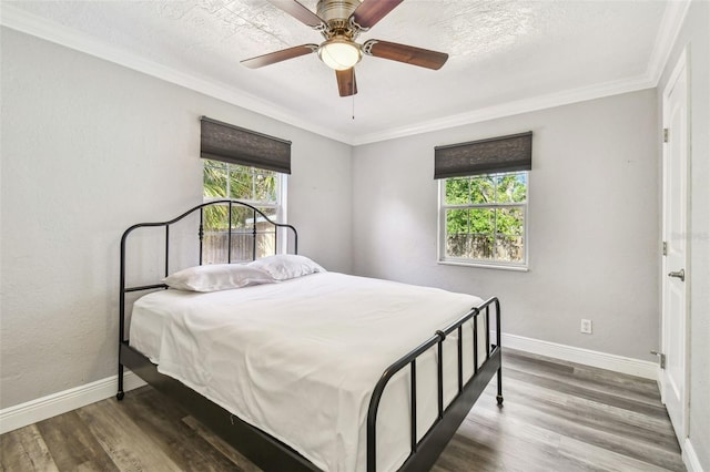 2018 21st St S, Saint Petersburg, FL 33712 - bedroom featuring baseboards, ornamental molding, wood finished floors, and ceiling fan