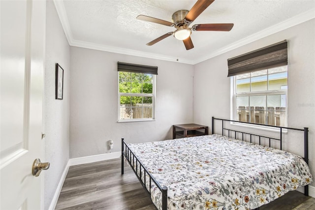 2018 21st St S, Saint Petersburg, FL 33712 - bedroom featuring baseboards, wood finished floors, crown molding, a ceiling fan, and a textured ceiling