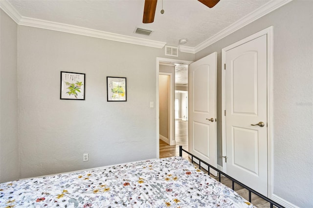 2018 21st St S, Saint Petersburg, FL 33712 - bedroom with wood finished floors, ornamental molding, a ceiling fan, and baseboards