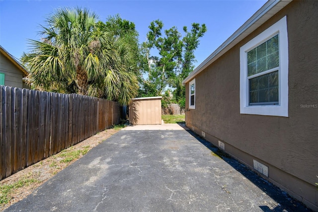 2018 21st St S, Saint Petersburg, FL 33712 - view of patio / terrace with fence, an outbuilding, and a storage shed