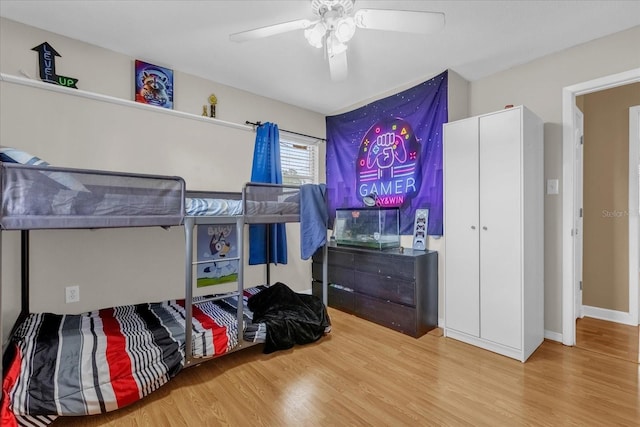 bedroom with wood finished floors and ceiling fan