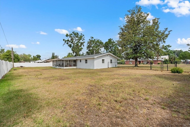 view of yard with a sunroom