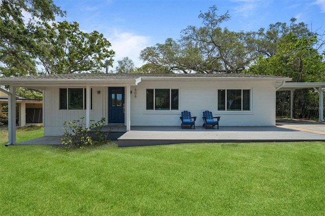 608 Betmor Ln, Palm Harbor, FL 34683 - back of property featuring a lawn