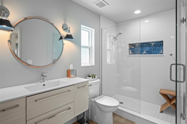 608 Betmor Ln, Palm Harbor, FL 34683 - bathroom with a shower stall, toilet, vanity, and recessed lighting