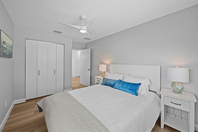 608 Betmor Ln, Palm Harbor, FL 34683 - bedroom with a closet, wood finished floors, baseboards, and ceiling fan