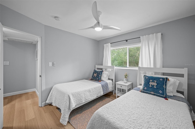 608 Betmor Ln, Palm Harbor, FL 34683 - bedroom featuring wood finished floors, attic access, a ceiling fan, and baseboards