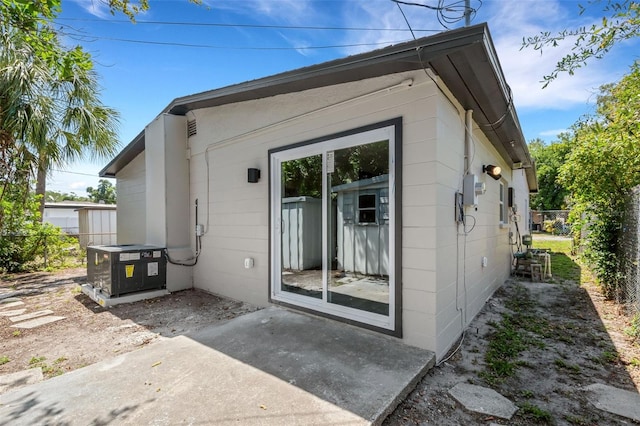 3151 6th Ave S, Saint Petersburg, FL 33712 - back of property featuring a patio area and cooling unit