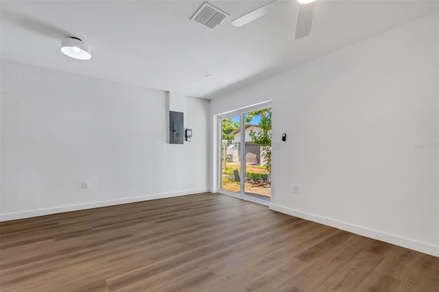 3151 6th Ave S, Saint Petersburg, FL 33712 - spare room with electric panel, wood finished floors, baseboards, and ceiling fan