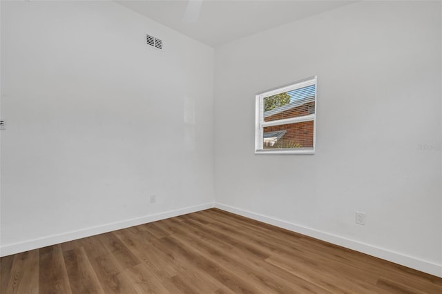 3151 6th Ave S, Saint Petersburg, FL 33712 - empty room with baseboards and wood finished floors