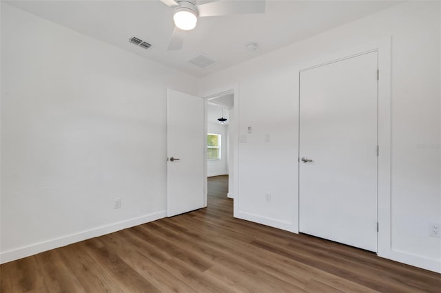 3151 6th Ave S, Saint Petersburg, FL 33712 - unfurnished bedroom with wood finished floors, baseboards, and ceiling fan