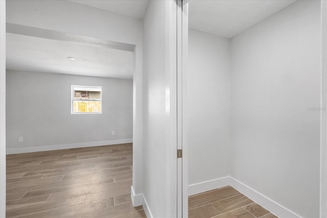 below grade area with wood finished floors and baseboards