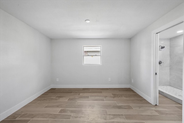 unfurnished bedroom featuring wood finish floors, baseboards, and recessed lighting