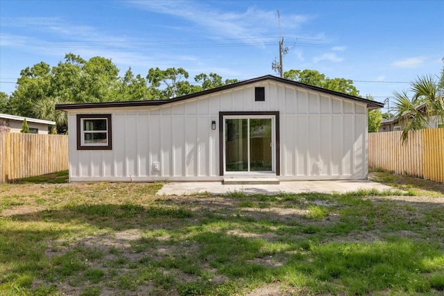 rear view of property with board and batten siding