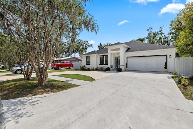 19212 Sunlake Blvd, Lutz, FL 33558 - view of front of property featuring a garage, stucco siding, driveway, and fence