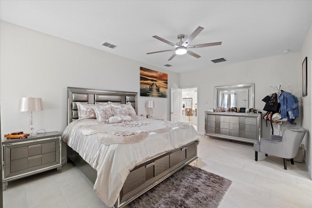 19212 Sunlake Blvd, Lutz, FL 33558 - bedroom with light tile patterned flooring, ceiling fan, and connected bathroom