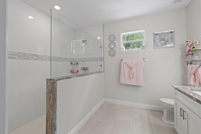 19212 Sunlake Blvd, Lutz, FL 33558 - full bathroom featuring vanity, a walk in shower, toilet, tile patterned flooring, and baseboards