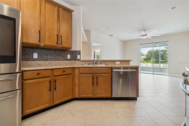 2262 Lune Ct, Melbourne, FL 32904 - kitchen with stainless steel appliances, a sink, ceiling fan, plenty of natural light, and recessed lighting