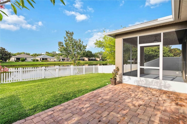 2262 Lune Ct, Melbourne, FL 32904 - view of patio with a water view, a sunroom, and a residential view