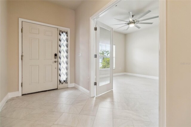 2262 Lune Ct, Melbourne, FL 32904 - foyer featuring a ceiling fan and baseboards