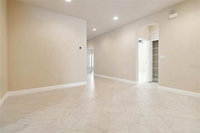 2262 Lune Ct, Melbourne, FL 32904 - unfurnished room with arched walkways, recessed lighting, and baseboards