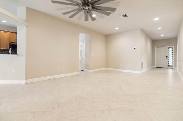 2262 Lune Ct, Melbourne, FL 32904 - empty room featuring ceiling fan, recessed lighting, arched walkways, and baseboards