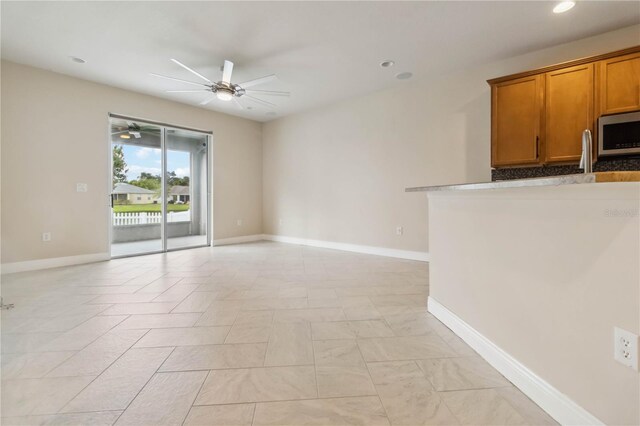 2262 Lune Ct, Melbourne, FL 32904 - unfurnished living room featuring a ceiling fan, recessed lighting, and baseboards