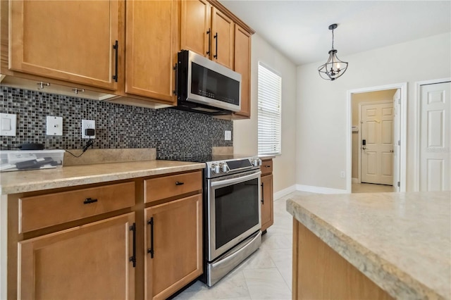 2262 Lune Ct, Melbourne, FL 32904 - kitchen featuring appliances with stainless steel finishes, backsplash, hanging light fixtures, and brown cabinets