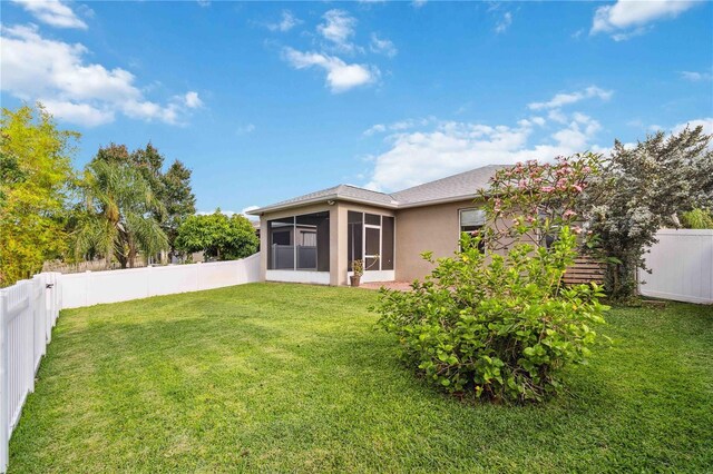 2262 Lune Ct, Melbourne, FL 32904 - view of yard with a sunroom