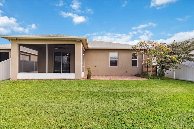 2262 Lune Ct, Melbourne, FL 32904 - rear view of house with a sunroom, stucco siding, and ceiling fan